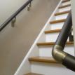 Interior closeup shot of rail mounted on stairwell